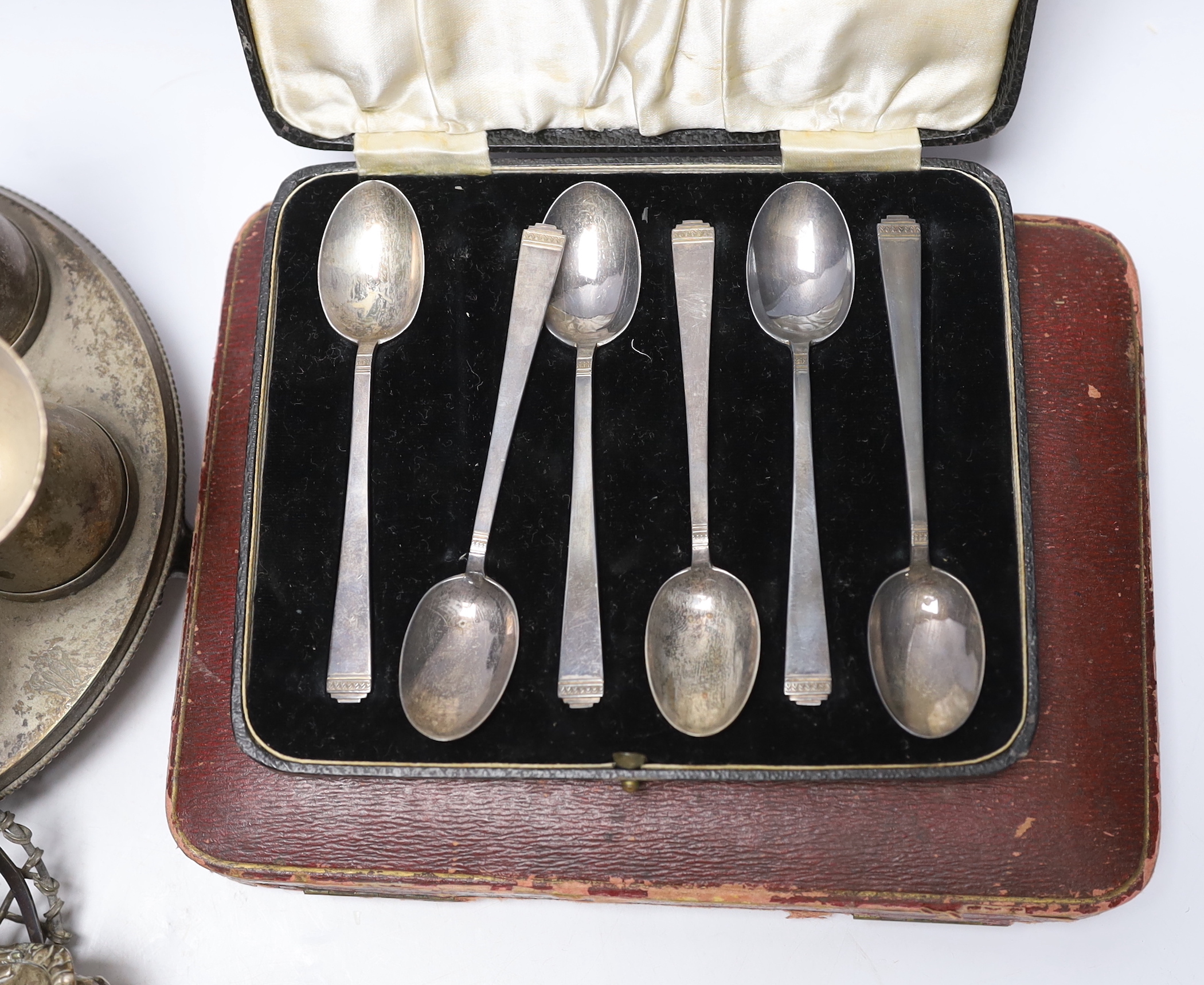 Sundry silver including three piece condiment set, two cased sets of teaspoons, five other condiments, salt spoons, pair of small pierced holders, inkwell and a small rose bowl, together with various plated items.